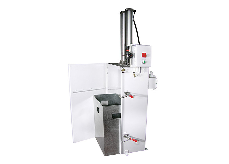 A white industrial waste compactor with an open cabinet door and a removable metal bin.