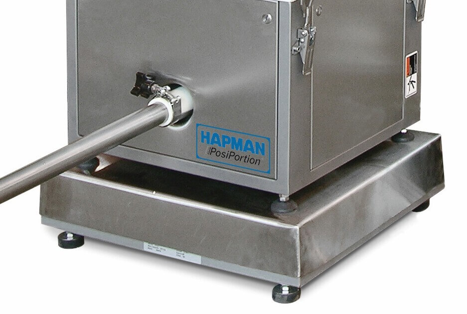 A Hapman PosiPortion industrial feeder with a stainless steel housing and a discharge tube.