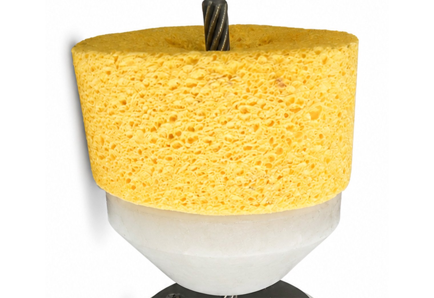 A yellow cylindrical sponge mounted on a white tapered base with a metal rod extending through the center.